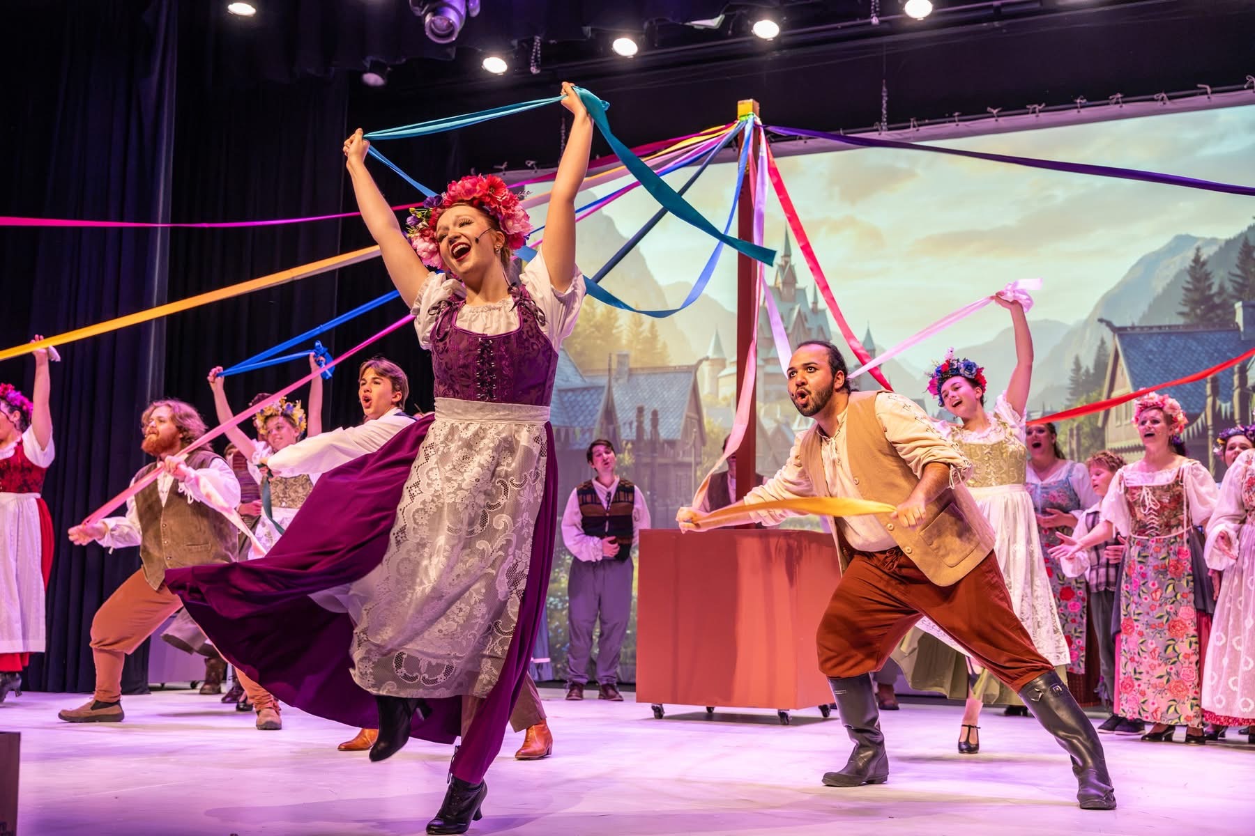 The Frozen company performing before Nick Carr Studio's projected Arendelle environment